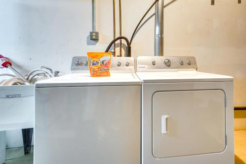 two small refrigerators and a stove in a kitchen at Howard Cabin Rental about 3 Mi to Apple Valley Lake! in Mount Vernon
