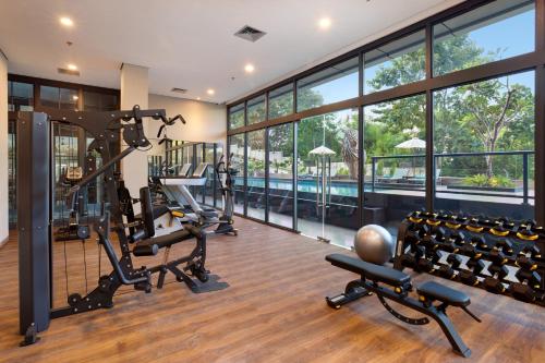 a gym with treadmills and elliptical machines at Sima Sumba Hotel in Tambolaka