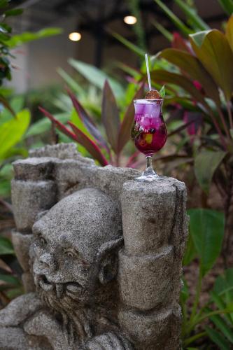 a wine glass sitting on top of a statue at Hotel Nya in Montezuma