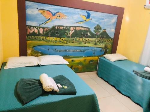 Säng eller sängar i ett rum på Pousada Voadores Jalapão