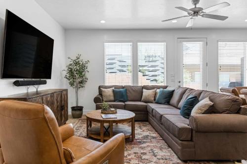a living room with a couch and a flat screen tv at Narrow's Gateway townhouse in Washington