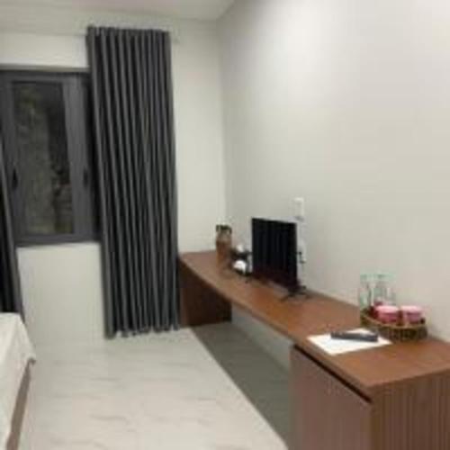 Đức Lưu Quang Hotel Bình Thuậnにあるテレビまたはエンターテインメントセンター