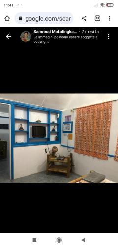 a picture of a living room with a tv at Sun House Rental in Mambajao
