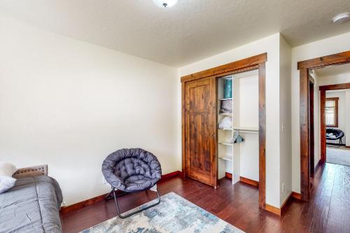 a living room with a couch and a chair at Craftsman Comforts in Sandpoint