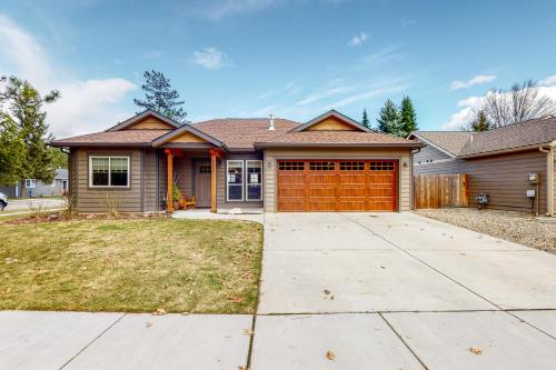 a house with a brown garage at Craftsman Comforts in Sandpoint