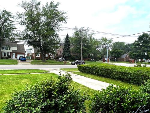 a sidewalk in a residential neighborhood with a street at Entire Home in Buffalo - 6 Guests 3 Bedroom 1 Bath - Convenient Location - 25min to Niagara Falls in Buffalo