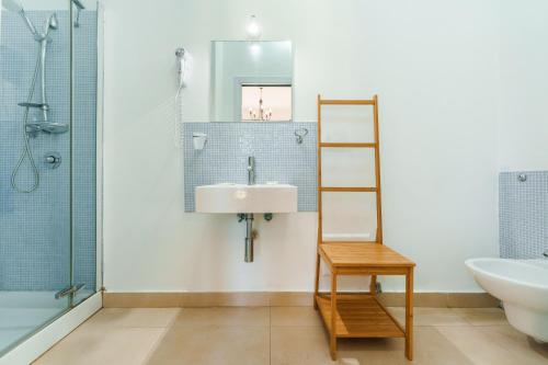 a bathroom with a sink and a shower at Villa Mazzella in Procida