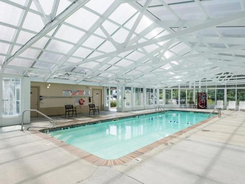 a large swimming pool with a glass ceiling at MVC - Unit 1505 - Bearly Available in Pigeon Forge