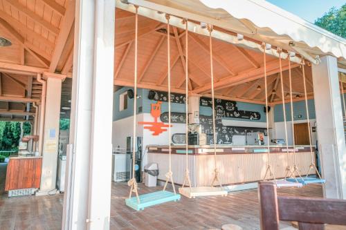a kitchen in a house with awning at Calimera Ralitsa Superior Hotel - Ultra All Inclusive plus Aquapark in Albena
