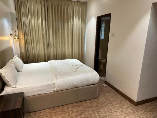 מיטה או מיטות בחדר ב-Hotel Imperial Executive