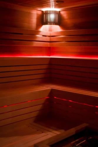 a room with a table and a light on it at Jarzębinowy Resort & SPA in Braniewo