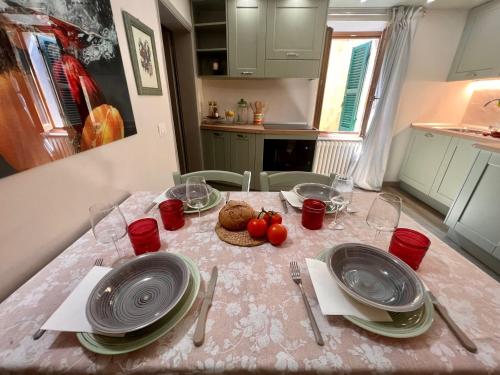 a table with plates and bowls of food on it at CasaVacanze Donna Manu in Cetona