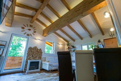 a living room with a couch and a fireplace at AusZeit Steiraland Penthouse 9 mit großen Balkon und Parkplatz in Leoben