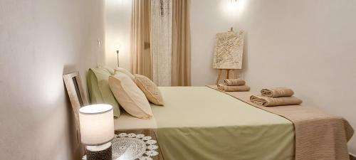 a bedroom with a large bed in a room at House on Sea Sifnos in Cherronisos