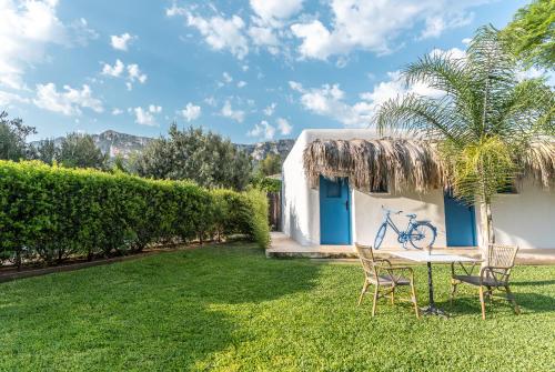 a table and chairs in the yard of a house at Boho Suites Denia in Denia