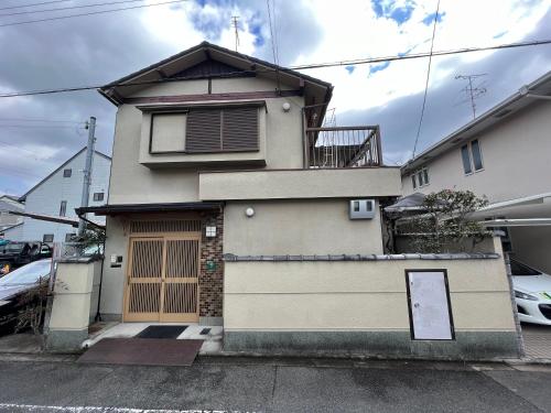 a house with a garage in front of it at PLATINUM kitaoji in Kyoto