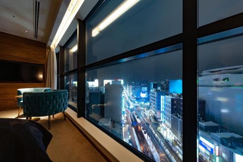 a room with a large window with a view of a city at The not Sapporo - Vacation STAY 96538v in Sapporo