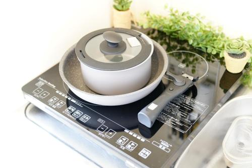 a coffee maker sitting on top of a counter at Kameari 911 Budget Stay High Floor Near Station Mall Disney Access in Tokyo