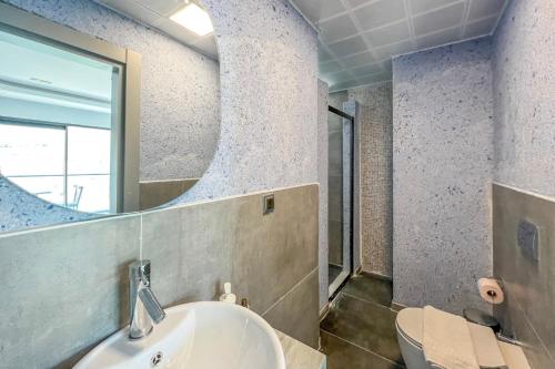 a bathroom with a sink and a mirror at Stonehillkaş in Kas