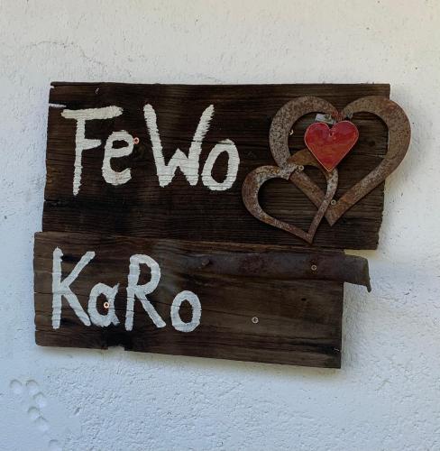 a sign that says fwo krao with a heart at Ferienwohnung KaRo in Bodensdorf