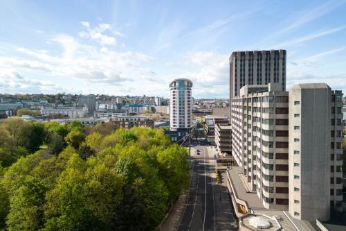 a view of a city with tall buildings and trees at Delta Hotels by Marriott Bristol City Centre in Bristol