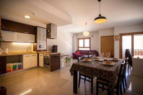 a kitchen and dining room with a table and chairs at Santa Clara Residence in Lisbon