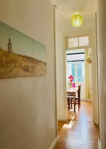 a dining room with a table and a window at Downtown Apartment in Horta