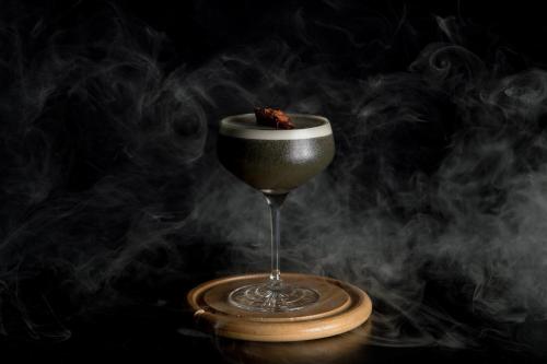 a glass of smoke with a piece of food in it at W Bellevue in Bellevue