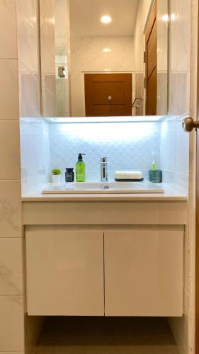 a bathroom counter with a sink and a mirror at Cozy place @ Chiangrai in Chiang Rai