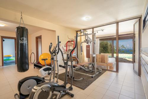 a gym with a punching bag and exercise equipment at Villa Kandia in Ayia Evfimia