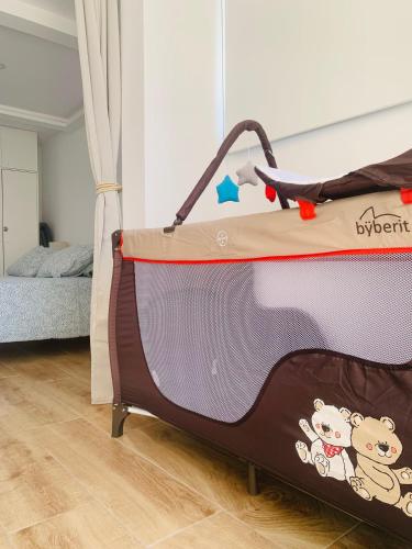 an open suitcase in a room with a bed at Ocean View Luxury Las Americas in Playa de las Americas