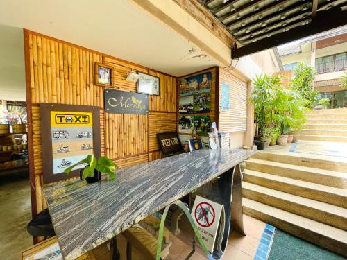 a counter in a restaurant with aitatingitating room with stairs at Meewaya Hotel in Chaweng