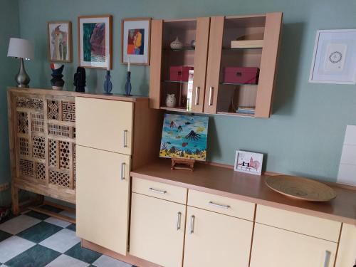 a kitchen with white cabinets and a counter top at Ferienwohnung in Worms in Worms