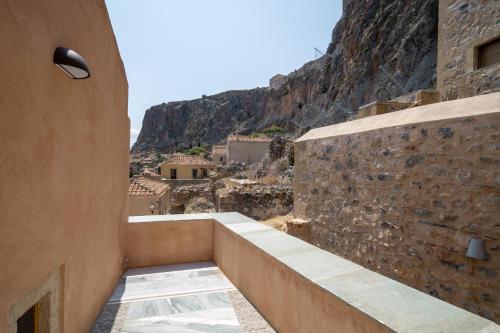 a building with a view of a mountain at Bastione Malvasia Hotel (ex New Malvasia) in Monemvasia