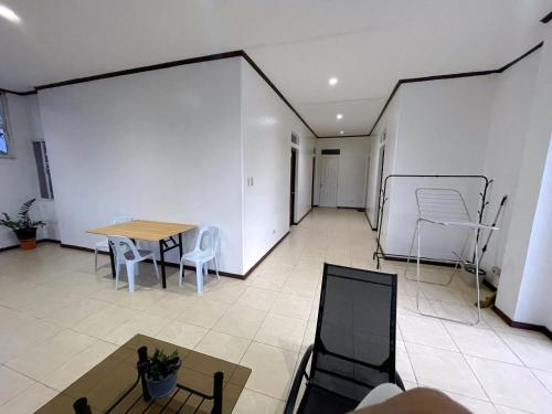 a room with a table and chairs and a table and a table at Best Inn Lahug in Cebu City