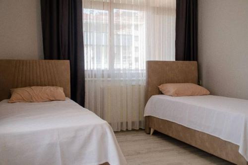 Postel nebo postele na pokoji v ubytování Apart Hotel-2