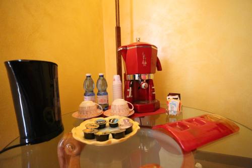 a table with a coffee maker on top of it at B & B L'almanacco in San Martino In Strada