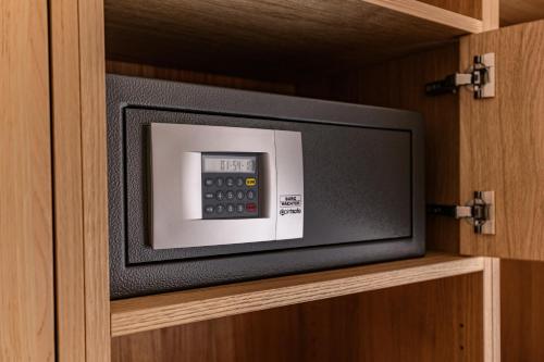 a television sitting on a shelf in a cabinet at DAS MORITZ- Fine Living Apartments in Nauders