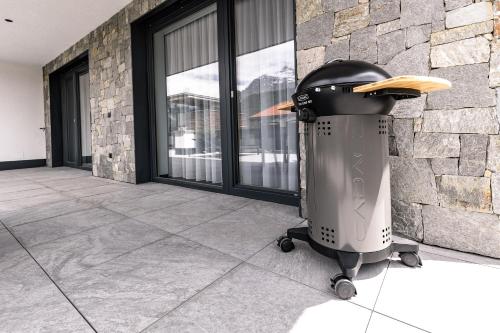 a trash can sitting in front of a window at DAS MORITZ- Fine Living Apartments in Nauders