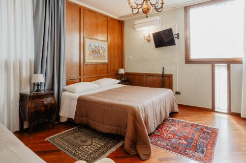 a hotel room with a bed and a window at Villa Luigi XVI in Taranto