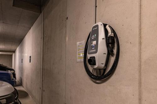 a parking meter on the wall of a parking garage at DAS MORITZ- Fine Living Apartments in Nauders
