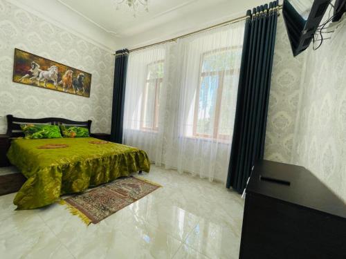 a bedroom with a bed and a television in it at Апартаменти в парку in Uman