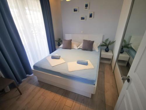 Posteľ alebo postele v izbe v ubytovaní Rita Apartments - Sea-view apartment 2plus1