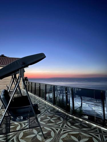 a view of the ocean from the balcony of a building at Goga Guest House in Kvariati