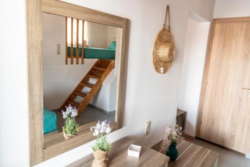 a mirror in a room with a bunk bed at Emmanouela Apartment in Matala
