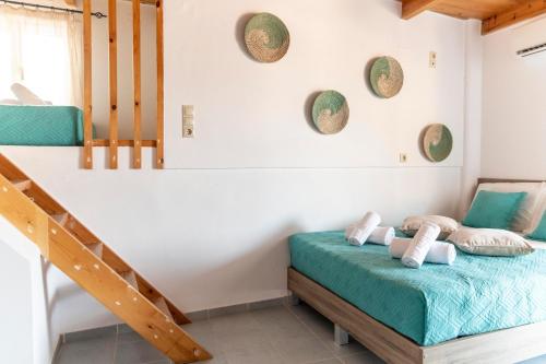 a bedroom with a bunk bed and a staircase at Emmanouela Apartment in Matala
