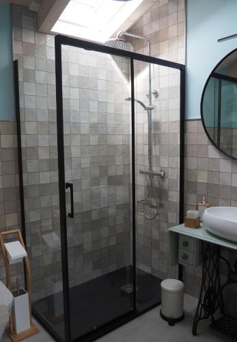 a bathroom with a shower and a sink at Casa gueli in Cangas de Onís