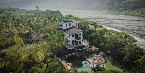 an aerial view of a house in the trees at 藏青谷 莊園Valley Statt Manor in Liugui