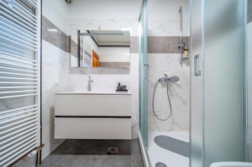 a bathroom with a sink and a shower at House Andrija in Jasenak