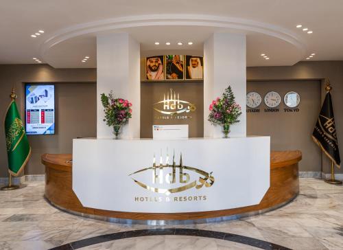 a lobby of a hotel with a reception counter at HDB Al Sahafa in Riyadh